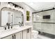 Stylish bathroom features dual sinks, sleek tile, and a glass-enclosed shower at 109 Riverbend Dr, Archer Lodge, NC 27527