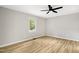 Bright bedroom featuring sleek flooring and a modern ceiling fan at 109 Riverbend Dr, Archer Lodge, NC 27527