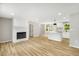 Spacious living room and kitchen featuring an electric fireplace and modern flooring at 109 Riverbend Dr, Archer Lodge, NC 27527