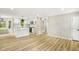 Open-concept living area and kitchen with bright lighting and modern finishes at 109 Riverbend Dr, Archer Lodge, NC 27527