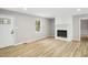 Living room with hardwood floors and an electric fireplace at 109 Riverbend Dr, Archer Lodge, NC 27527