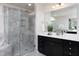 This bathroom features a glass enclosed shower and double sink vanity at 1102 Birchbark Rd, Durham, NC 27705