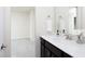 This bathroom includes a granite-topped dark vanity with a sink, a towel, and a view into the bedroom at 1102 Birchbark Rd, Durham, NC 27705