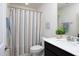 This bathroom features a single sink vanity and shower with curtain at 1102 Birchbark Rd, Durham, NC 27705