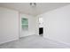 This bedroom boasts neutral walls and carpeting, a window with blinds, and an ensuite bathroom at 1102 Birchbark Rd, Durham, NC 27705