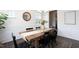 Traditional dining room with decorative lighting, a table centerpiece, and a wooden table with black chairs at 1102 Birchbark Rd, Durham, NC 27705
