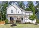 Beautiful home showcasing a welcoming front porch at 1102 Birchbark Rd, Durham, NC 27705