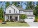 Charming home featuring a manicured lawn and attached two-car garage at 1102 Birchbark Rd, Durham, NC 27705