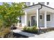 Inviting front porch with classic white columns at 1102 Birchbark Rd, Durham, NC 27705