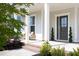 Inviting front porch with brick steps and a seating area, perfect for relaxing outdoors at 1102 Birchbark Rd, Durham, NC 27705