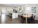 Modern kitchen with stainless steel appliances, a large island, and a dining area at 1102 Birchbark Rd, Durham, NC 27705