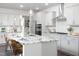 Bright kitchen featuring a spacious island with bar stools, modern appliances, and pendant lighting at 1102 Birchbark Rd, Durham, NC 27705