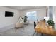 This living room features a tv, seating, and two desk spaces at 1102 Birchbark Rd, Durham, NC 27705