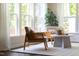 Sun-filled sitting room with a patterned rug, and a coffee table at 1102 Birchbark Rd, Durham, NC 27705