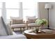 Bright living room featuring comfortable armchairs, accent pillows, and natural light at 1102 Birchbark Rd, Durham, NC 27705