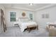 Serene bedroom with trey ceilings features neutral tones, soft lighting, and stylish decor elements at 1102 Birchbark Rd, Durham, NC 27705