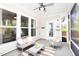 Covered patio offers a peaceful outdoor retreat with comfortable seating and neutral tones at 1102 Birchbark Rd, Durham, NC 27705