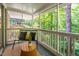 Charming balcony offering serene views of the surrounding lush greenery at 1111 Sourwood Cir, Chapel Hill, NC 27517