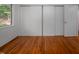 Bedroom with wooden floors and big closet at 1111 Sourwood Cir, Chapel Hill, NC 27517