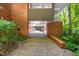 Spacious carport area showcasing brickwork and access to storage at 1111 Sourwood Cir, Chapel Hill, NC 27517
