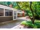 Home exterior view featuring patio and mature landscaping at 1111 Sourwood Cir, Chapel Hill, NC 27517