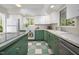 Well-maintained kitchen with updated appliances, countertops, and vintage-inspired cabinetry at 1111 Sourwood Cir, Chapel Hill, NC 27517