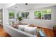 Bright seating area with access to the backyard, offering pool views and natural light at 1111 Sourwood Cir, Chapel Hill, NC 27517