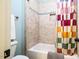The bathroom features tiled shower-tub with a colorful shower curtain for privacy and a stylish design at 113 Ruskin Dr, Chapel Hill, NC 27516