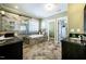 Beautiful bathroom featuring stone tile flooring, double vanity, soaking tub, and tiled shower with glass door at 113 Ruskin Dr, Chapel Hill, NC 27516