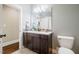 Charming bathroom featuring a double vanity with white countertop, tile backsplash, and a well-lit mirror at 113 Ruskin Dr, Chapel Hill, NC 27516
