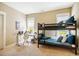 This bedroom features a bunk bed, a desk, and a large window to allow for ample natural lighting at 113 Ruskin Dr, Chapel Hill, NC 27516