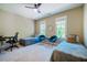 This bedroom offers two beds, a ceiling fan, and two windows offering lots of natural light at 113 Ruskin Dr, Chapel Hill, NC 27516