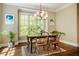 Dining area filled with natural light from large windows, accentuating its inviting ambiance at 113 Ruskin Dr, Chapel Hill, NC 27516