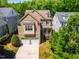 Two-story home with a two-car garage, covered porch, and dormer windows offering curb appeal at 113 Ruskin Dr, Chapel Hill, NC 27516