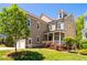 Charming two-story home with a well-manicured lawn, a covered front porch, and attached garage at 113 Ruskin Dr, Chapel Hill, NC 27516