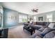 This living room features a large comfy sectional, windows for natural light, and stylish decor at 113 Ruskin Dr, Chapel Hill, NC 27516
