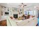 Open-concept living room with a fireplace, built-in shelving, and comfortable seating at 113 Ruskin Dr, Chapel Hill, NC 27516