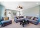 This living room features a large comfy sectional, windows for natural light, and stylish decor at 113 Ruskin Dr, Chapel Hill, NC 27516
