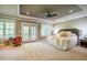 Spacious main bedroom with plush carpet, tray ceiling and access to a balcony at 113 Ruskin Dr, Chapel Hill, NC 27516