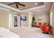 Large and bright carpeted bedroom with a sitting area and wall-mounted TV at 113 Ruskin Dr, Chapel Hill, NC 27516
