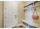 Functional mudroom featuring built-in storage, hooks, and bench seating to keep belongings organized at 113 Ruskin Dr, Chapel Hill, NC 27516