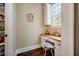 Charming home office nook featuring a built-in desk, natural light, and a view of the outdoors at 113 Ruskin Dr, Chapel Hill, NC 27516