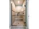 Luxurious glass enclosed tiled shower with a built in bench and a decorative tile border at 113 Ruskin Dr, Chapel Hill, NC 27516
