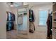 Well-organized walk-in closet with built-in shelving, mirrored wall, and ample hanging space at 113 Ruskin Dr, Chapel Hill, NC 27516