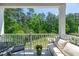Relaxing balcony with ample seating and outdoor views overlooking community greenery at 11549 Helmond Way # 107, Raleigh, NC 27617