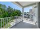 Spacious balcony featuring picturesque views overlooking the trees and nearby community at 11549 Helmond Way # 107, Raleigh, NC 27617