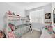 Cozy bunk room featuring a white bunk bed and colorful bedding perfect for  at 11549 Helmond Way # 107, Raleigh, NC 27617