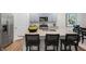 Modern kitchen with stainless steel appliances, granite countertops, island, and barstool seating at 1200 Pavo Path, Wendell, NC 27591