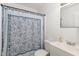 Bathroom featuring a decorative shower curtain, white toilet and vanity with sink at 1223 Jamestown Ct, Cary, NC 27511