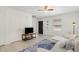 Bright living room features neutral paint, a ceiling fan, and tiled floors with a patterned blue rug at 1223 Jamestown Ct, Cary, NC 27511